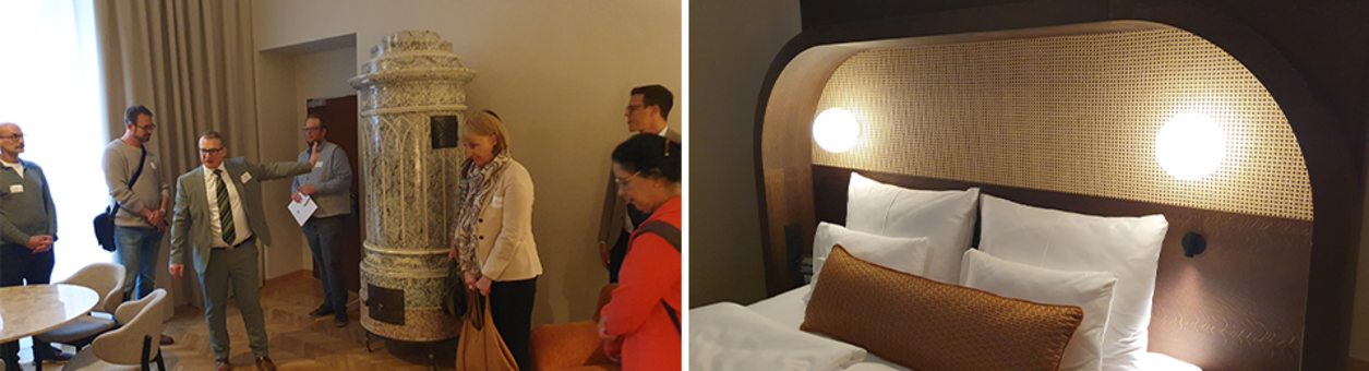 Besuchergruppe im Hotelzimmer mit historischem Kachelofen und Betthaupt Hotelbett